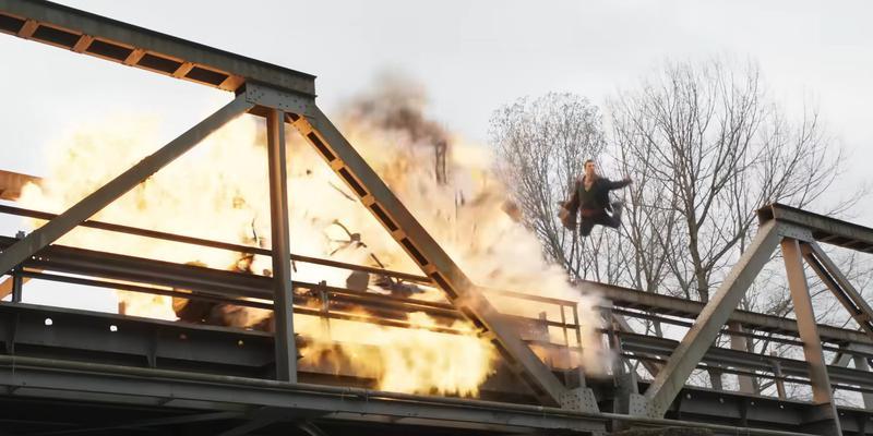 Glen Powell escapes an explosion in The Running Man
