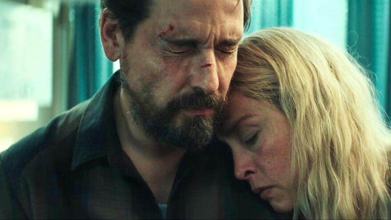 Simon and Meret holding one another in Unfamiliar.