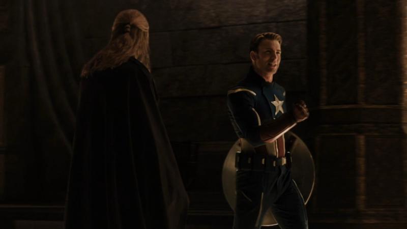 Chris Hemsworth as Thor, Chris Evans as Steve Rogers/Captain America in Thor: The Dark World