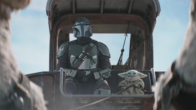 Mando and Grogu sitting in a cart in The Mandalorian & Grogu trailer.