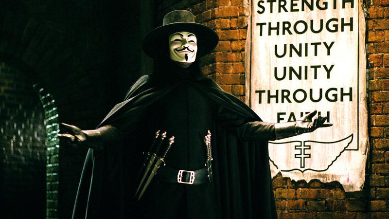 Hugo Weaving as V holding out his arms in V for Vendetta