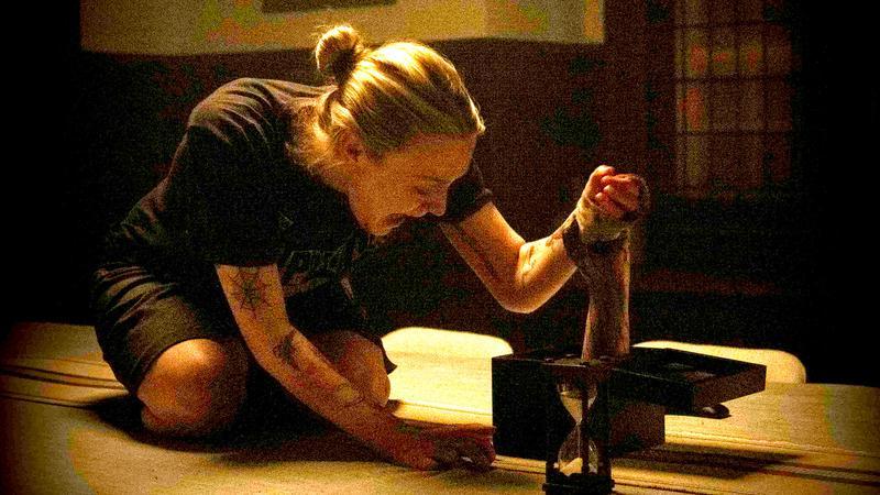 Dakota Fanning in Vicious being grabbed by an unknown hand.