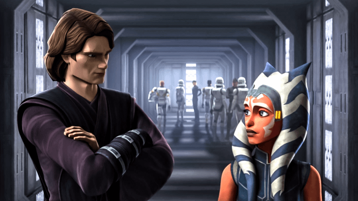 Anakin Skywalker looking at Ahsoka as the two stand in front of a hallway filled with clone troopers.