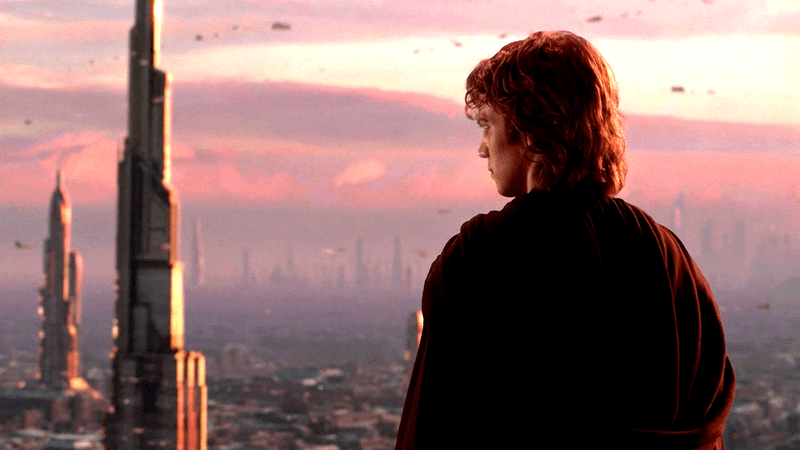 Hayden Christensen as Anakin Skywalker looking out at a city in Revenge of the Sith