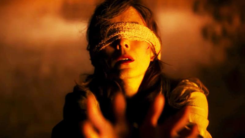 The Yeti woman tied up and blindfolded.