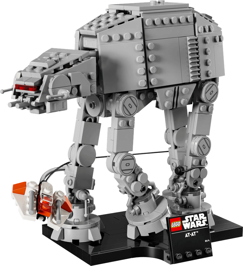 The small AT-AT LEGO set with a snow speeder flying around its legs