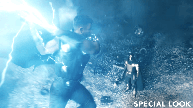 Thor winding up to hit Doom.