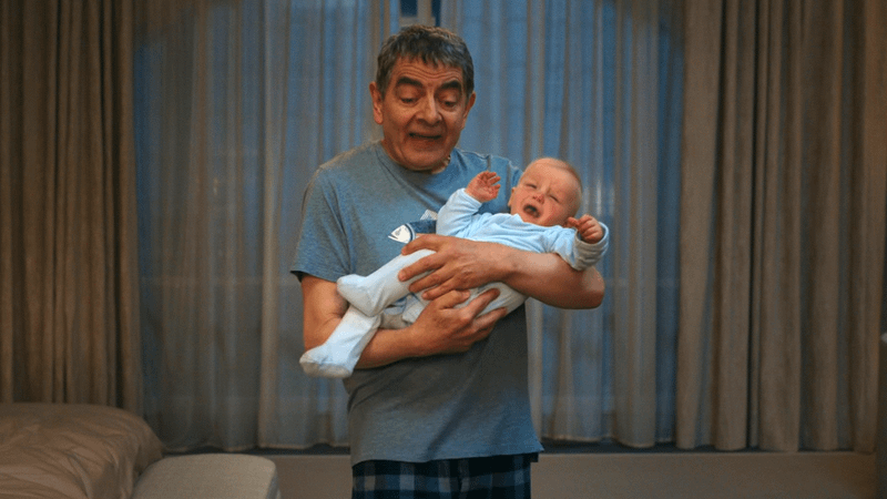 Rowan Atkinson as Trevor Bingley & the baby in Man vs. Baby