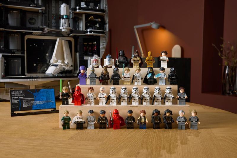 A lineup of several LEGO Star Wars minifigures sitting on a desk in the new LEGO Death Star set