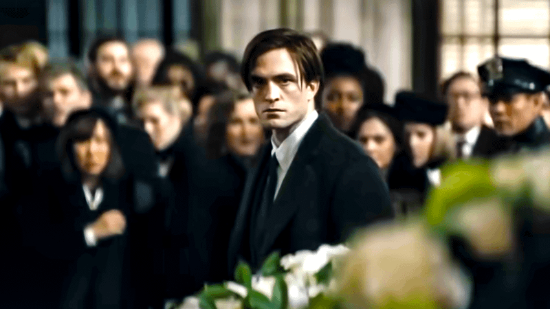Robert Pattinson's Bruce Wayne with a concerned look on his face.