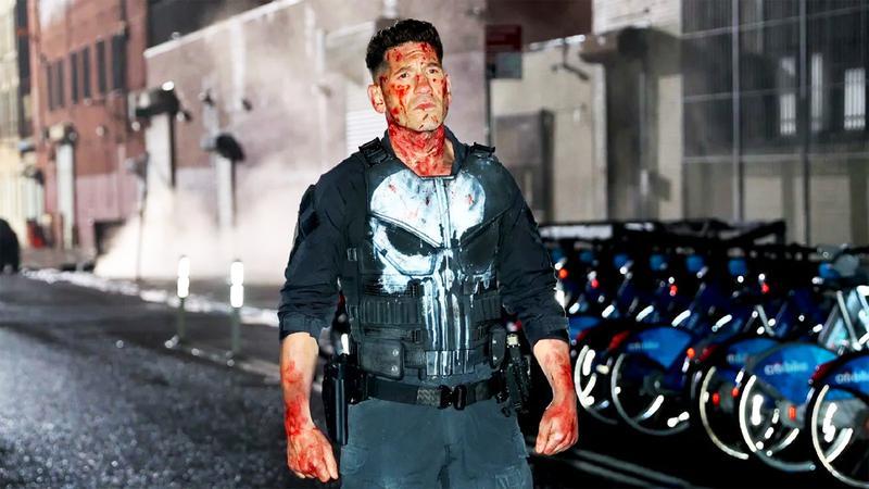 Frank Castle with blood all over his face and hands.