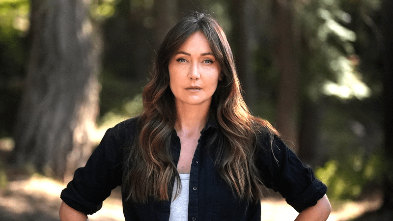 Jessica Chobot standing with her hands on her hips in Bigfoot Took Her