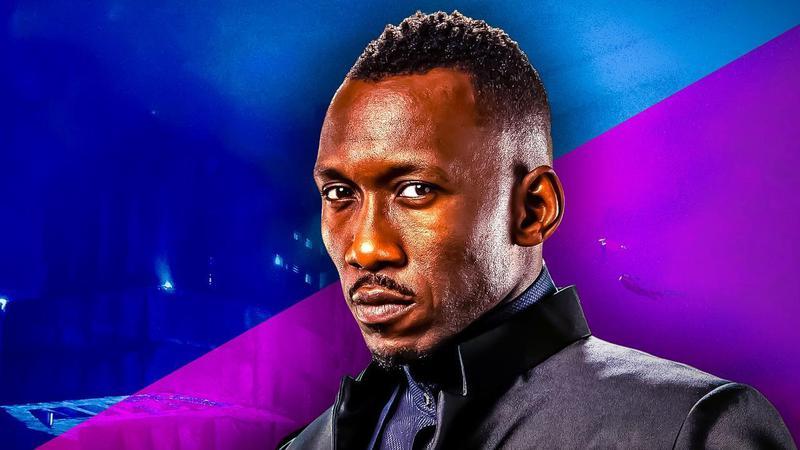 Mahershala Ali against blue and purple split background.