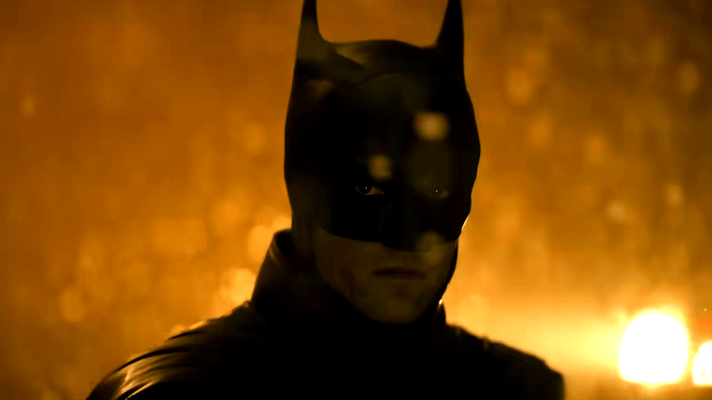 Batman in his cape and cowl.