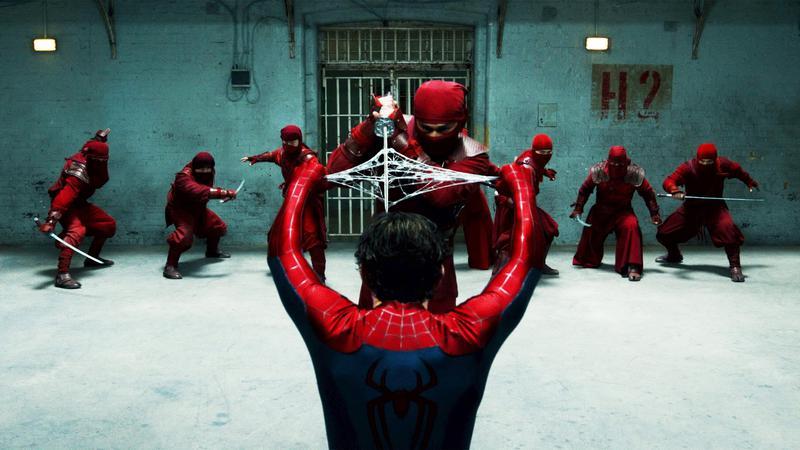 Spider-Man holding The Hand's sword with his webs.