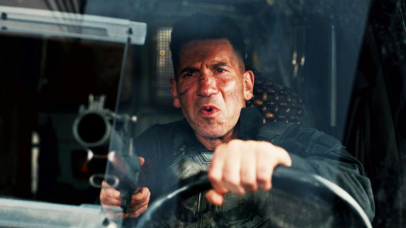 The Punisher holding a gun against Spider-Man.