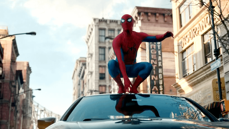 Spider-Man on a car roof.