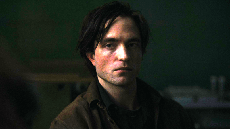 Robert Pattinson as Bruce Wayne looking distraught in The Batman