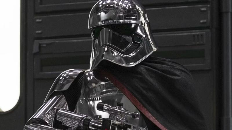 Captain Phasma holding a blaster in Star Wars: The Last Jedi.