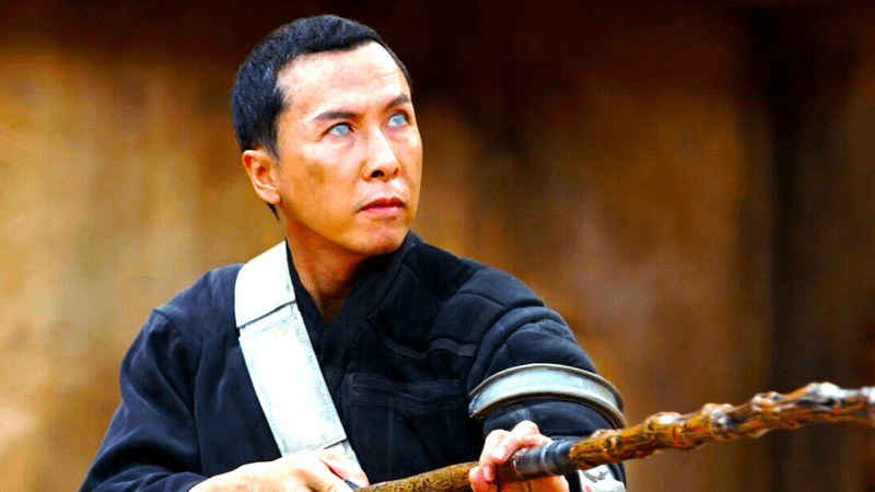 Donnie Yen as Cirrut Imwe holding a bo staff  in Rogue One: A Star Wars Story