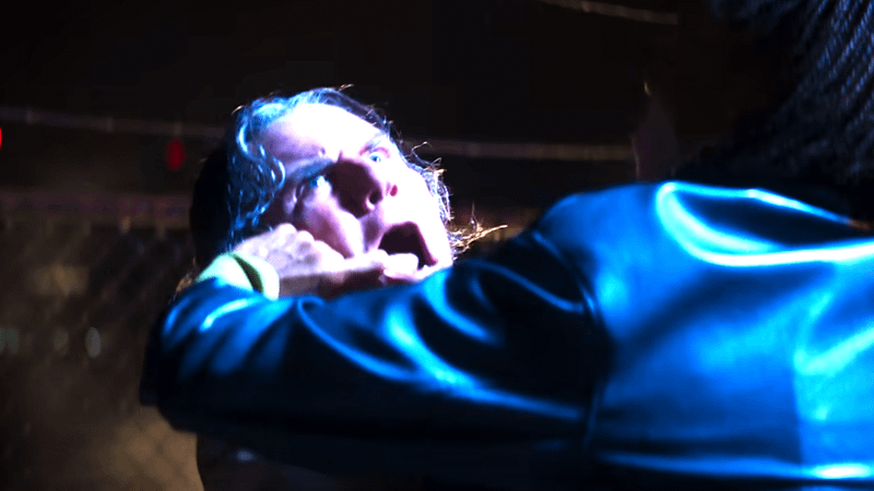 A man being hooked by the mouth in Clayface.