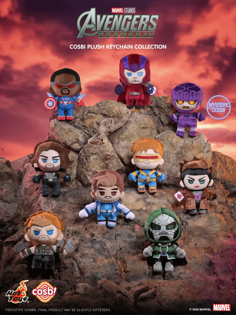 A collection of Cosbi Plush Keychains on a rock.