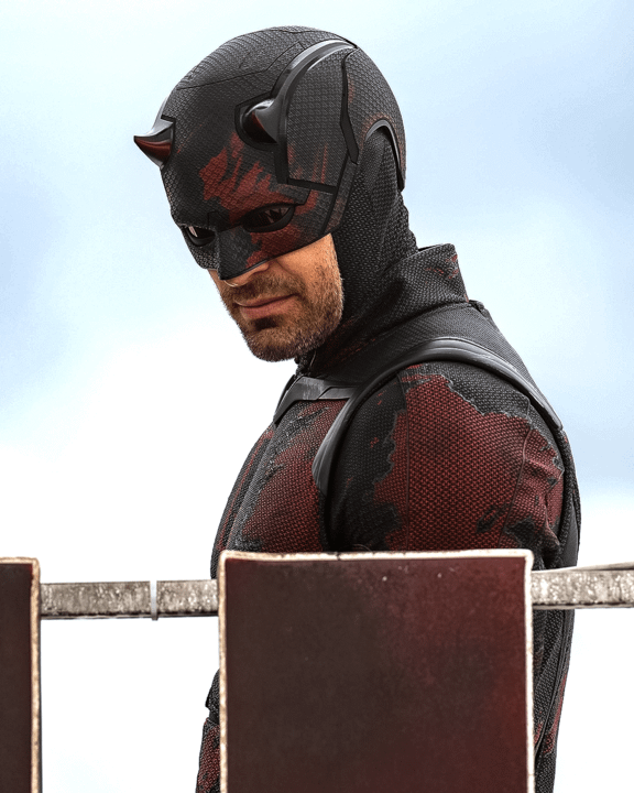 Charlie Cox as Daredevil in his black suit with red accents.