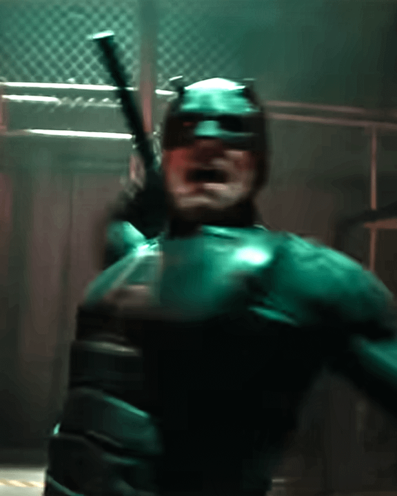 Charlie Cox as Daredevil in his black suit mid-fight.