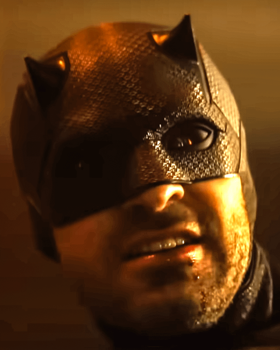 A close-up of Matt Murdock's face with a black mask.