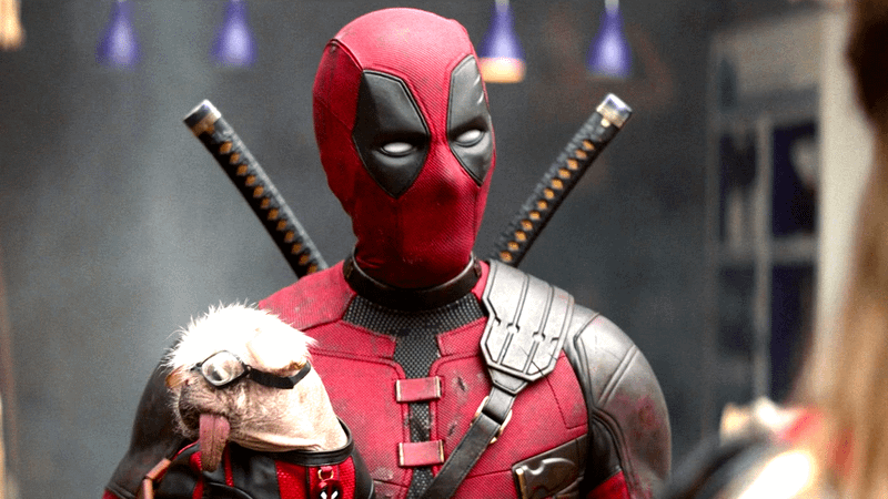 Ryan Reynolds as Deadpool holding Dogpool in Deadpool & Wolverine