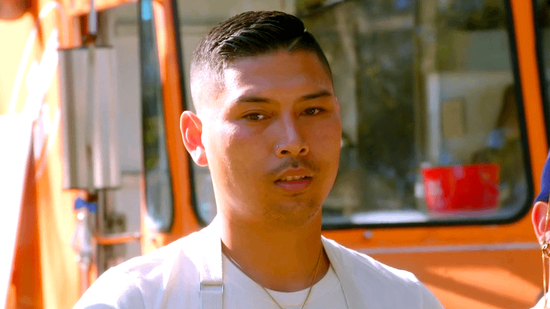 Devin Keopraphay standing in front of his Rising Tiger food truck in The Great Food Truck Race