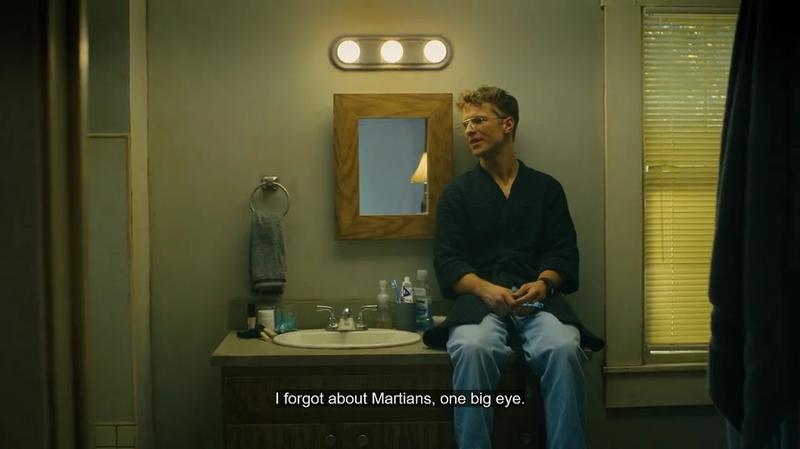 Chris Conrad as Adrian Chase sitting on a sink in Peacemaker