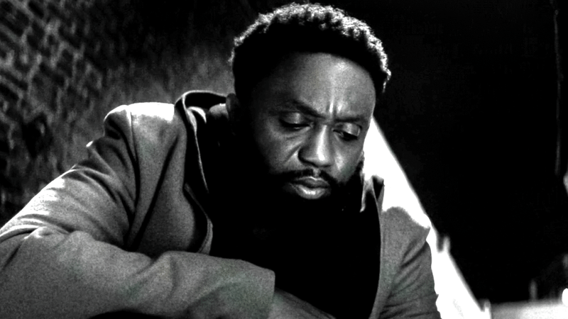 Byron Bowers as DeMarr Davis, kneeling in an alley and looking down in Marvel Television's Wonder Man.