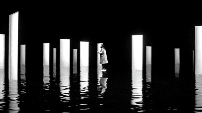 DeMarr Davis walks among a number of white doors in the Darkforce Dimension in Marvel Television's Wonder Man.