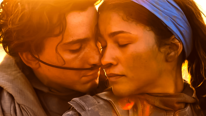 Paul and Chani in an embrace in Dune.