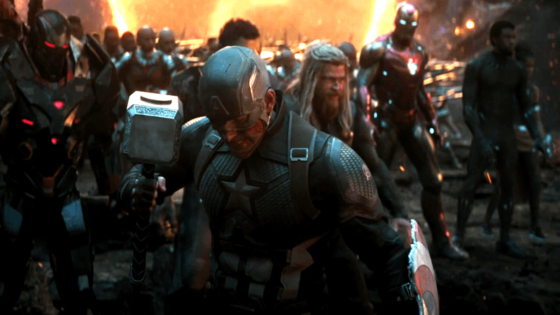 Steve Rogers holding Mjolnir alongside other Endgame heroes. 
