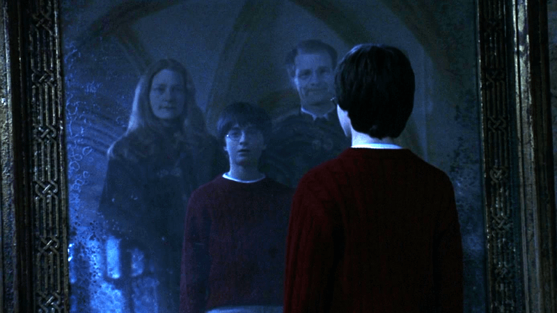 Daniel Radcliffe as Harry Potter looking into the Mirror of Erised in 'Harry Potter and the Sorcerer's Stone.'