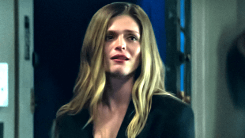 Molly Griggs as Eve Blanchard standing in a doorway in Prodigal Son