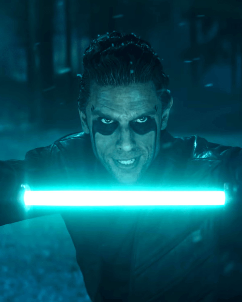 A character wielding a cyan lightsaber in Ahsoka.