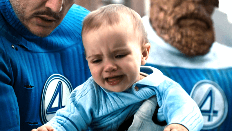 Franklin Richards crying in the arms of Pedro Pascal as Reed Richards in Fantastic Four: First Steps