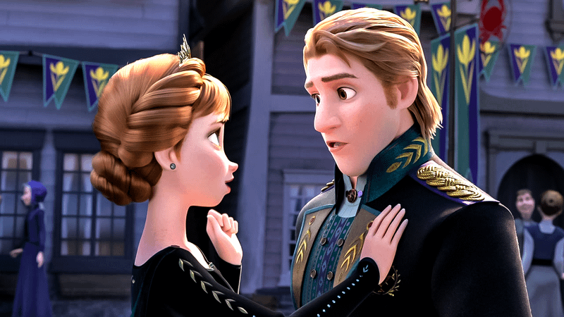 Anna and Kristoff in royal attire in Frozen.