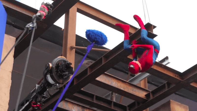 Tom Holland as Spider-Man hanging off a beam in BTS footage from 'Spider-Man: Brand New Day.'