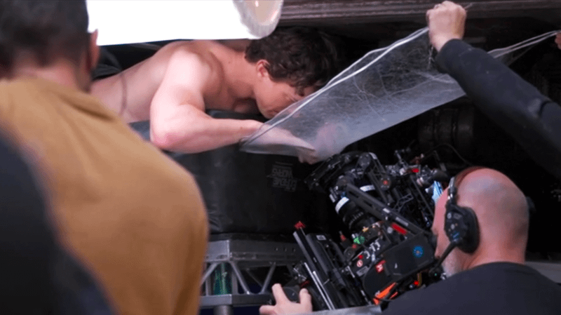 Tom Holland peeling through web as Peter Parker in 'Spider-Man: Brand New Day.