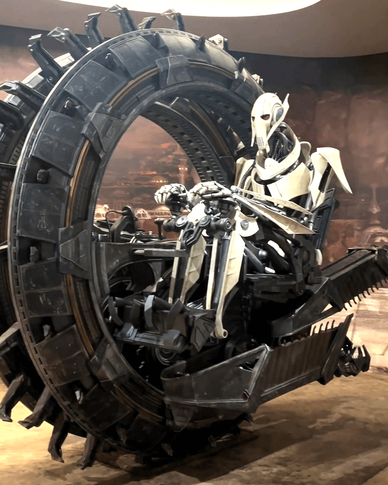 Life-size model of General Greivous driving a TSMEU-6 wheel bike from 'Star Wars: Episode III — Revenge of the Sith.'