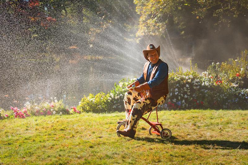 Roc Schneider as the Dwarf Cowboy riding a tricycle in Happy Gilmore 2