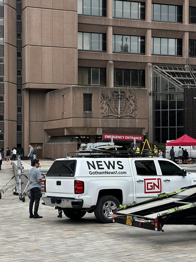 Gotham News 1 van in front of brown building on Clayface set