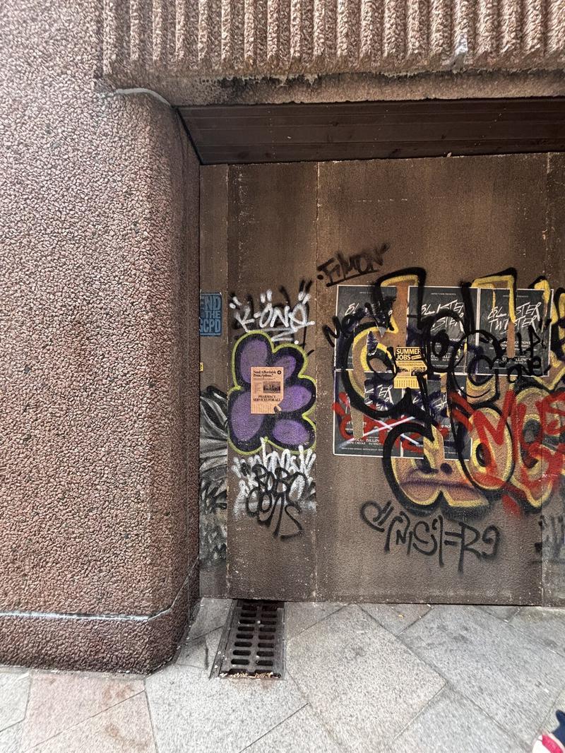 graffitti on tan building on set of Clayface movie