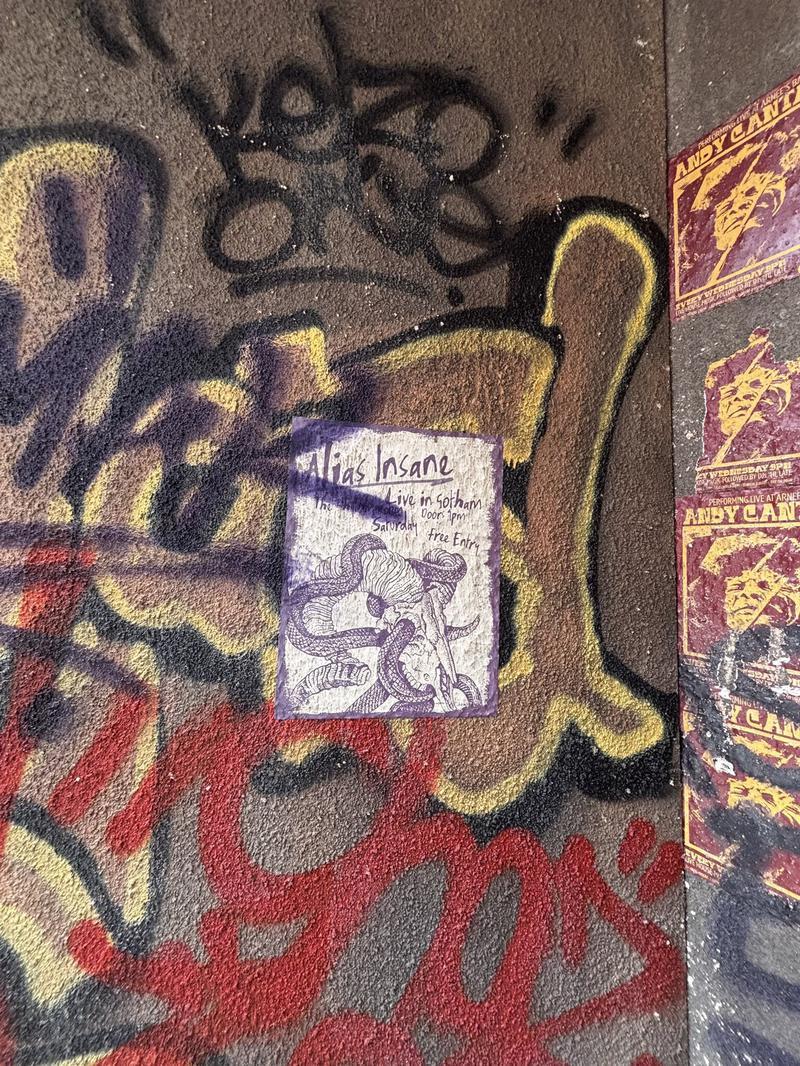 graffiti and Alias Insane poster on wall on Clayface set