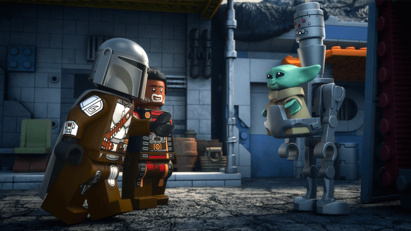 Din Djarin and Greef Karga looking at Grogu and IG-12 in LEGO Star Wars: The Mandalorian.