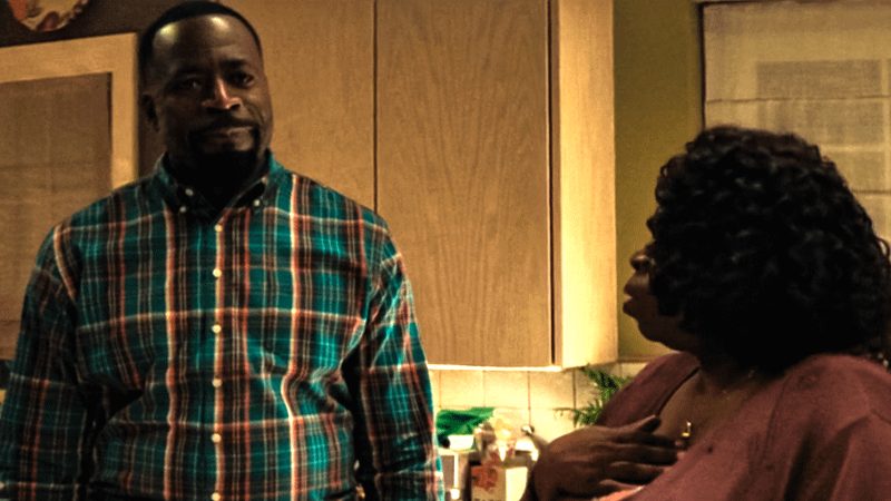 Eric Williams next to his mother in the kitchen.